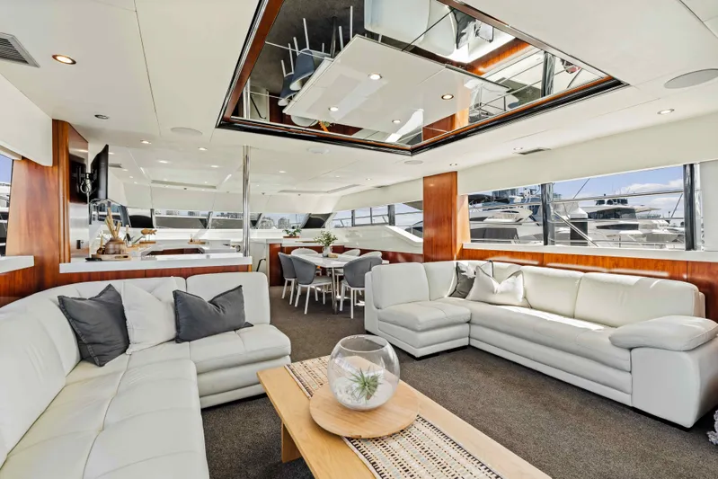 Infinite Yacht Photos Pics Luxurious interior of 1999 Warren Yachts 85 Motor Yacht with elegant seating and dining area.