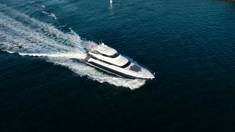 Infinite Yacht Photos Pics 1999 Warren Yachts 85 Motor Yacht cruising on open water.