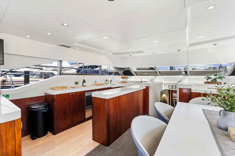 Infinite Yacht Photos Pics Luxurious interior of 1999 Warren Yachts 85 Motor Yacht with modern kitchen and seating area.
