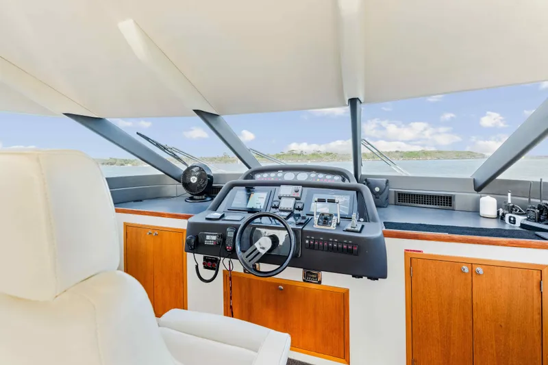 Infinite Yacht Photos Pics Helm of 1999 Warren Yachts 85 Motor Yacht with modern controls and panoramic view.