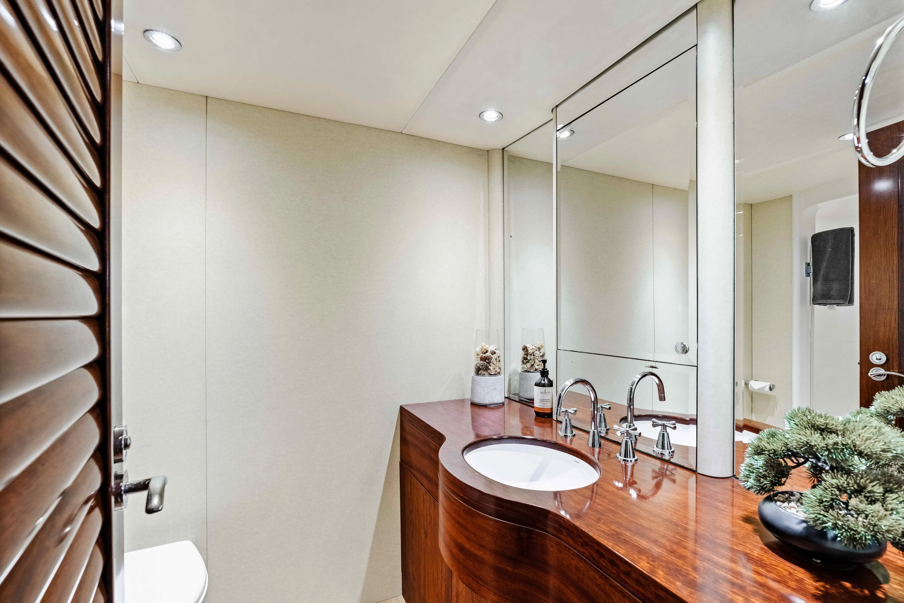 Infinite Yacht Photos Pics Luxurious bathroom in 1999 Warren Yachts 85 Motor Yacht with elegant wood finish.