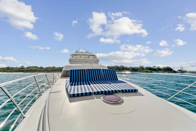 Infinite Yacht Photos Pics Luxurious 1999 Warren Yachts 85 Motor Yacht with sunbathing deck on open water.