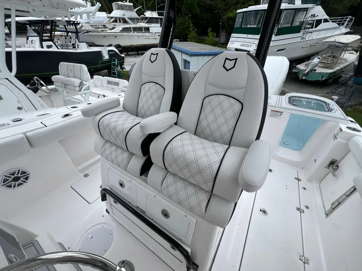  Yacht Photos Pics Luxury seating on 2025 Sea Fox 288 Commander boat, featuring elegant white upholstery.