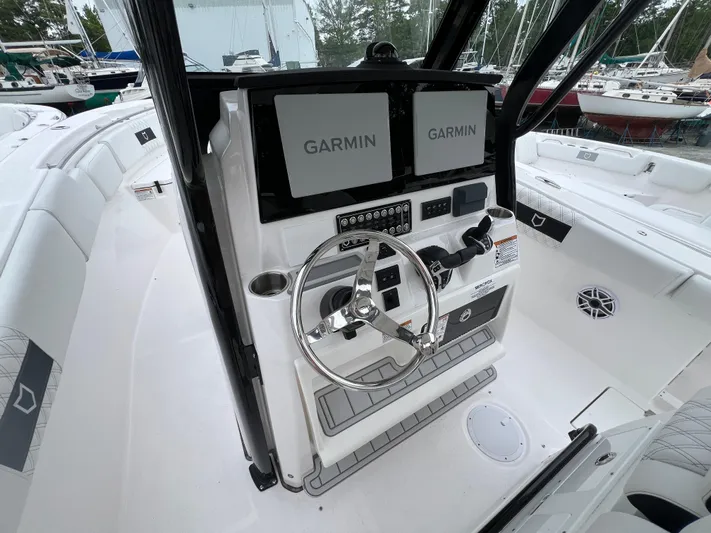  Yacht Photos Pics 2025 Sea Fox 288 Commander helm with dual Garmin displays and modern controls.