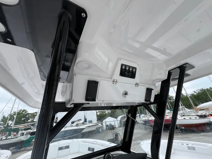  Yacht Photos Pics 2025 Sea Fox 288 Commander boat interior with overhead console and storage.