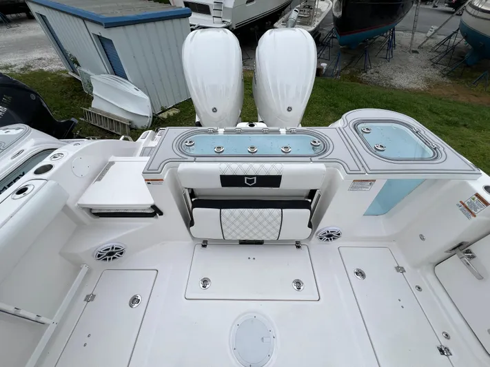  Yacht Photos Pics 2025 Sea Fox 288 Commander boat deck with seating and storage compartments.