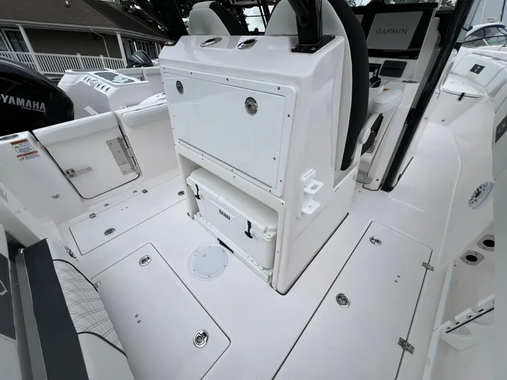  Yacht Photos Pics 2025 Sea Fox 288 Commander boat interior with storage compartments and Garmin equipment.