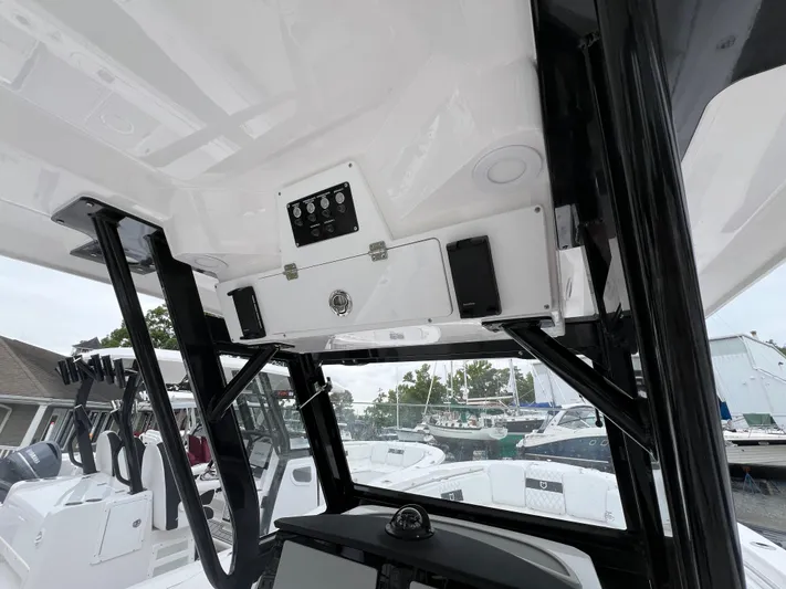  Yacht Photos Pics 2025 Sea Fox 288 Commander boat interior with control panel and seating.