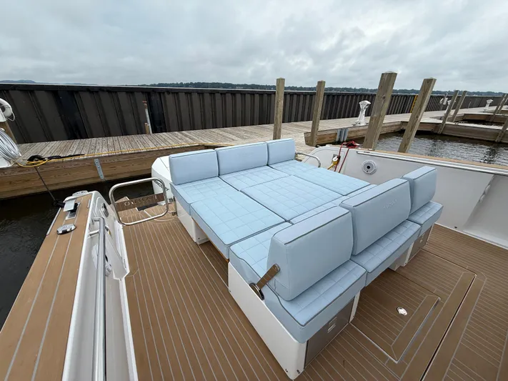  Yacht Photos Pics 2025 Pardo Yachts 38 Outboard with light blue seating at a dock.