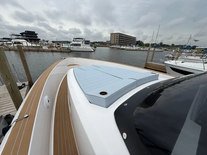  Yacht Photos Pics 2025 Pardo Yachts 38 Outboard docked at a marina under cloudy skies.