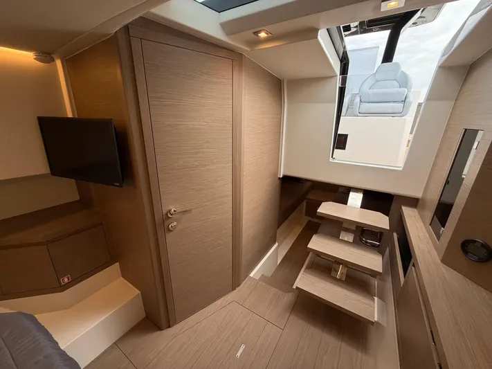  Yacht Photos Pics Luxurious interior of 2025 Pardo Yachts 38 Outboard, featuring modern wood finishes and sleek design.