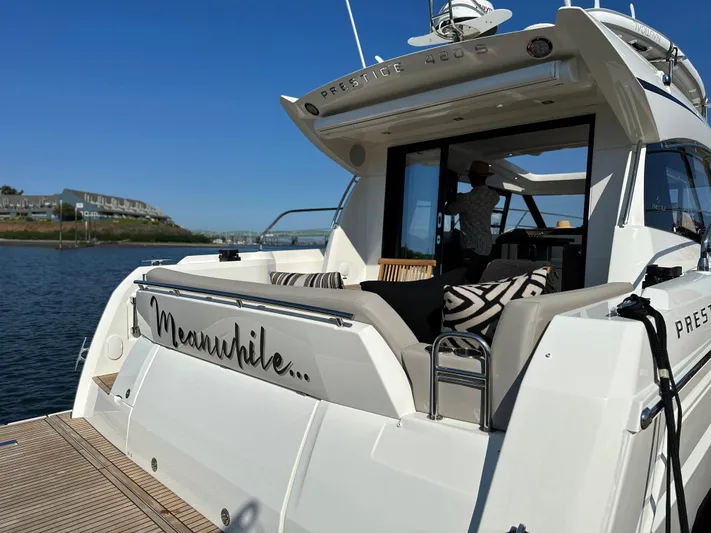 Meanwhile Yacht Photos Pics 2021 Prestige 420 S yacht docked with open deck and seating area.