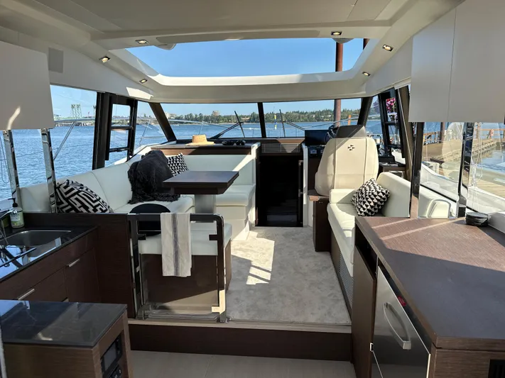 Meanwhile Yacht Photos Pics Interior of 2021 Prestige 420 S yacht with modern furnishings and panoramic windows.