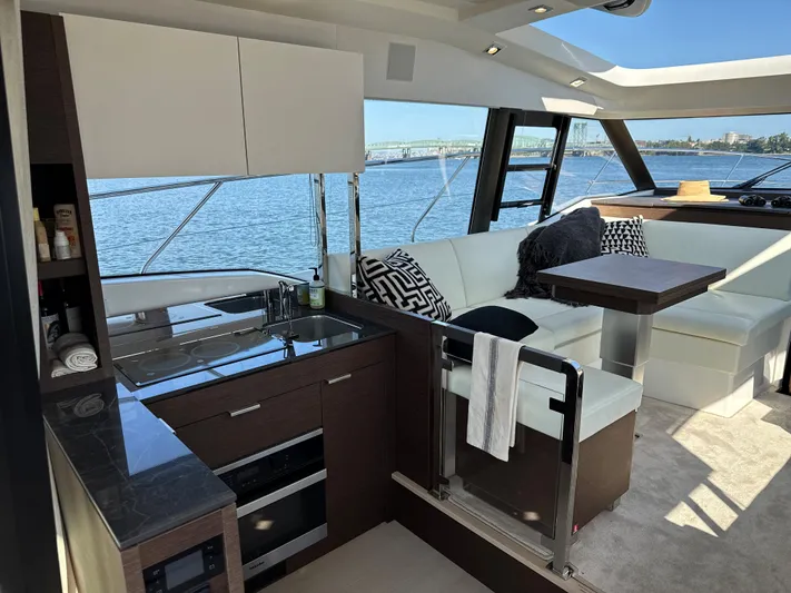 Meanwhile Yacht Photos Pics Interior of 2021 Prestige 420 S yacht with modern kitchen and seating area.