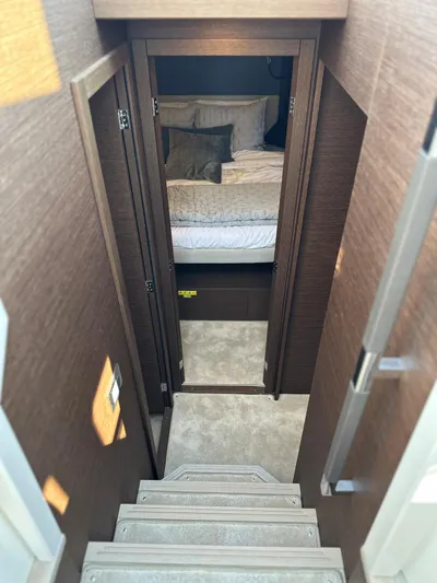 Meanwhile Yacht Photos Pics Interior view of 2021 Prestige 420 S yacht showing stairs leading to a cozy bedroom.