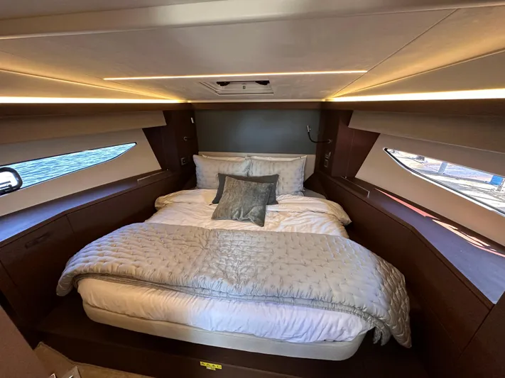 Meanwhile Yacht Photos Pics Luxurious bedroom interior of 2021 Prestige 420 S yacht with modern lighting and cozy bedding.