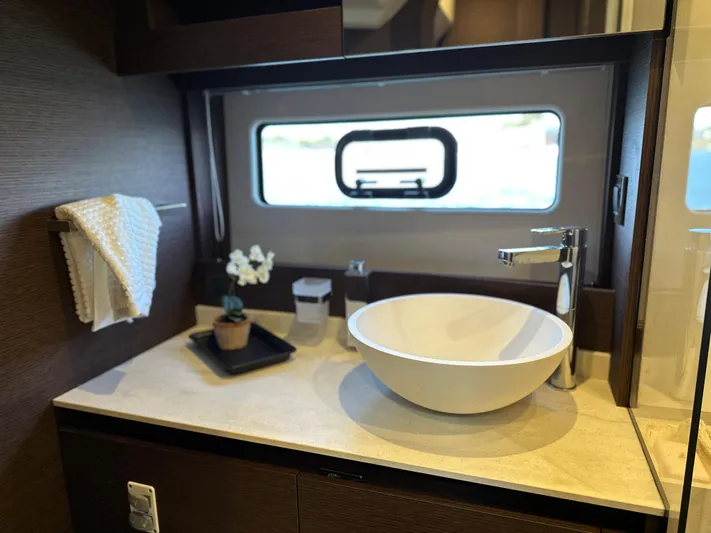 Meanwhile Yacht Photos Pics Modern bathroom sink in 2021 Prestige 420 S yacht with window view.