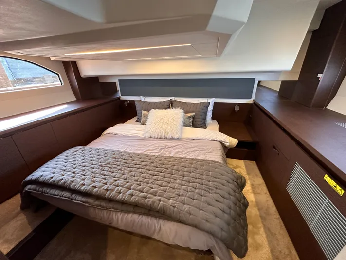 Meanwhile Yacht Photos Pics Luxurious bedroom interior of 2021 Prestige 420 S yacht with cozy bedding.