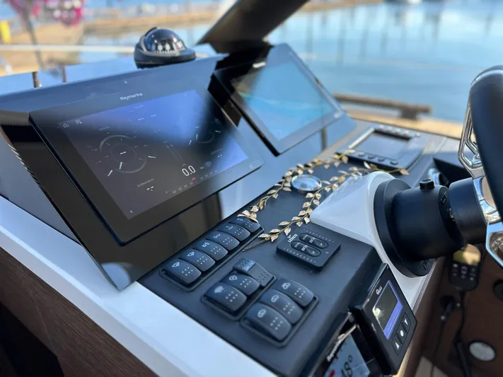 Meanwhile Yacht Photos Pics Control panel of 2021 Prestige 420 S yacht with navigation screens and buttons.