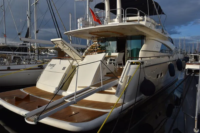  Yacht Photos Pics Luxury 2004 Fairline Squadron 74 yacht docked at marina, showcasing elegant design.