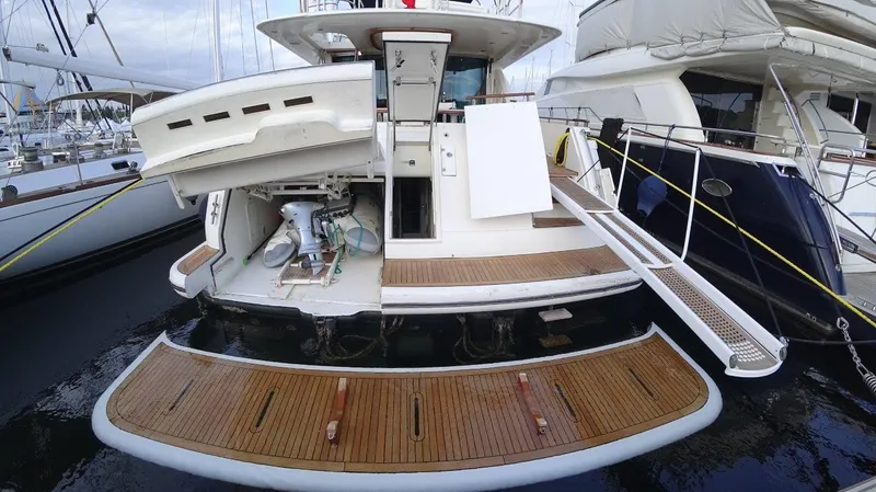  Yacht Photos Pics 2004 Fairline Squadron 74 yacht with open deck and boarding platform.