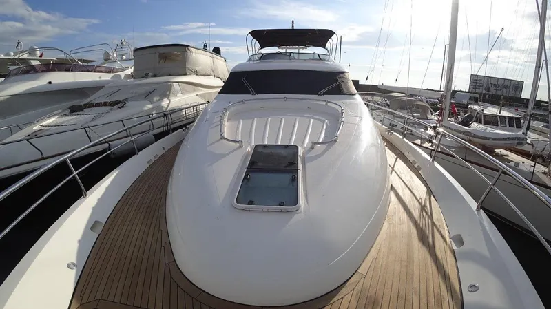  Yacht Photos Pics 2004 Fairline Squadron 74 yacht docked at marina, showcasing sleek design and spacious deck.