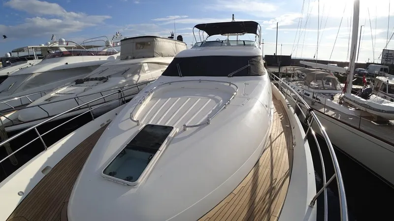  Yacht Photos Pics 2004 Fairline Squadron 74 yacht docked at marina, showcasing sleek design and luxury features.