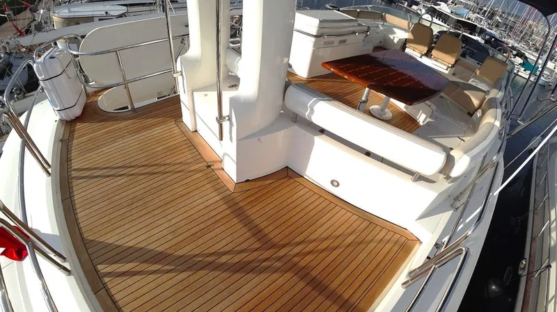  Yacht Photos Pics Luxury deck of 2004 Fairline Squadron 74 yacht with wooden flooring and seating area.