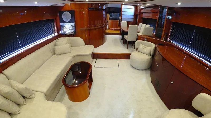  Yacht Photos Pics Luxurious interior of 2004 Fairline Squadron 74 yacht with elegant seating and wood finishes.