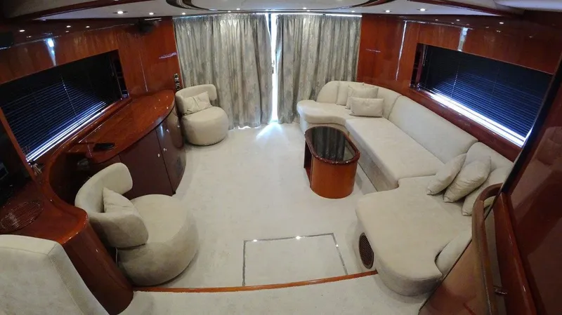  Yacht Photos Pics Luxurious interior of 2004 Fairline Squadron 74 yacht with elegant seating and wooden finishes.