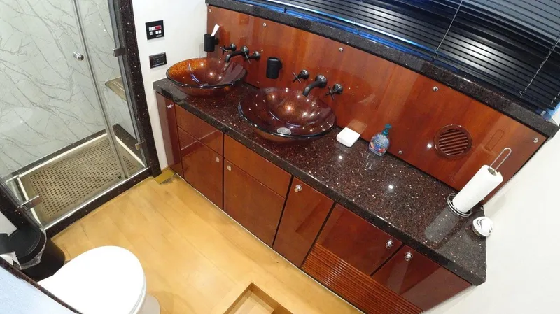  Yacht Photos Pics Luxurious bathroom in 2004 Fairline Squadron 74 yacht with dual sinks and modern shower.