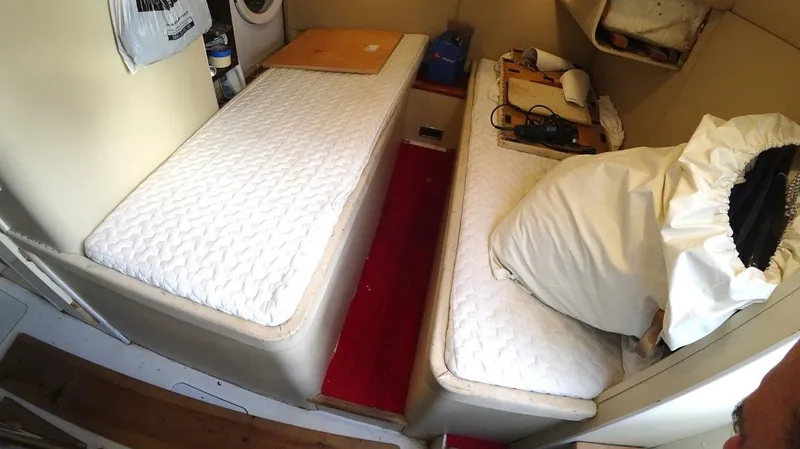  Yacht Photos Pics Cabin interior of 2004 Fairline Squadron 74 with twin beds and red carpet.