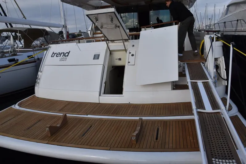  Yacht Photos Pics 2004 Fairline Squadron 74 yacht with teak deck and open hatch at marina.