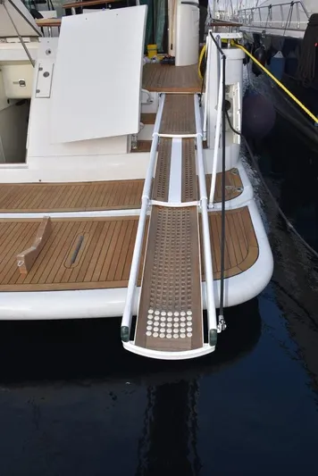  Yacht Photos Pics Fairline Squadron 74 yacht gangway, 2004 model, with teak decking and stainless steel railings.