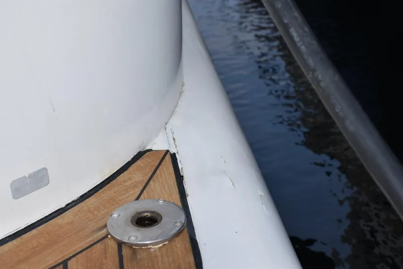  Yacht Photos Pics Close-up of 2004 Fairline Squadron 74 yacht deck detail by the water.