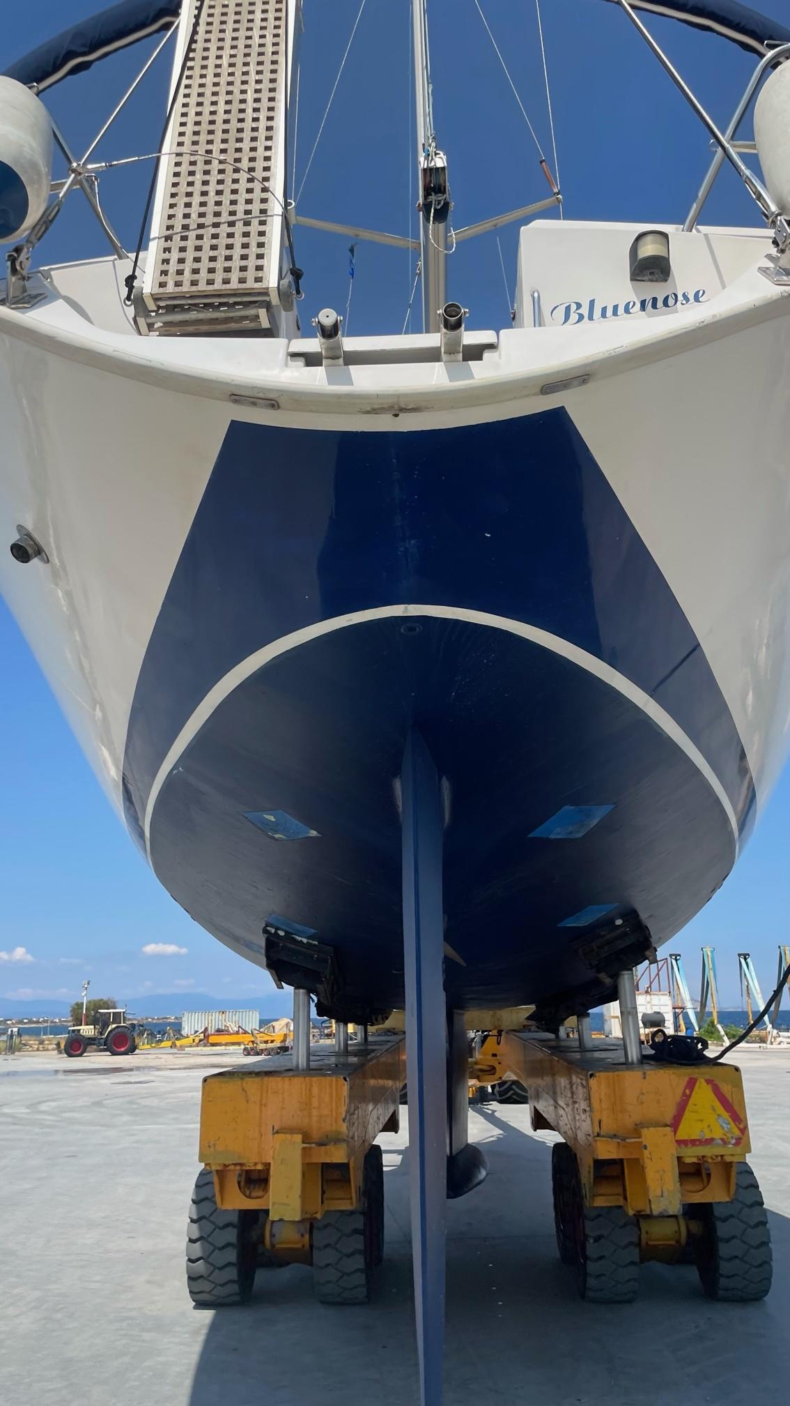 Sailboat "Alpha 51" from 2003 on a trailer, viewed from the stern.
