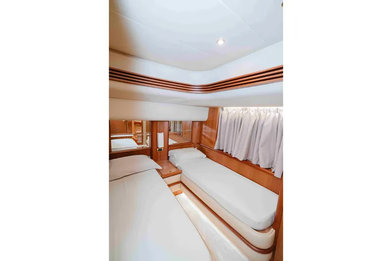 Marshej Yacht Photos Pics Luxurious cabin interior of 2008 Azimut Fly 68 yacht with twin beds and elegant wood finish.