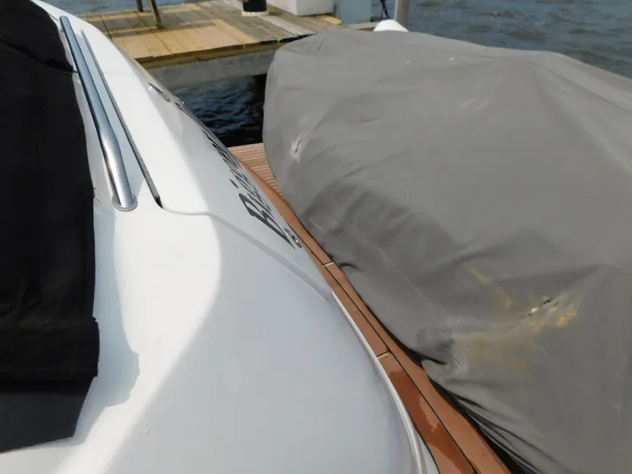  Yacht Photos Pics 2001 Sea Ray 510 Sundancer docked, partially covered, with water and dock visible.