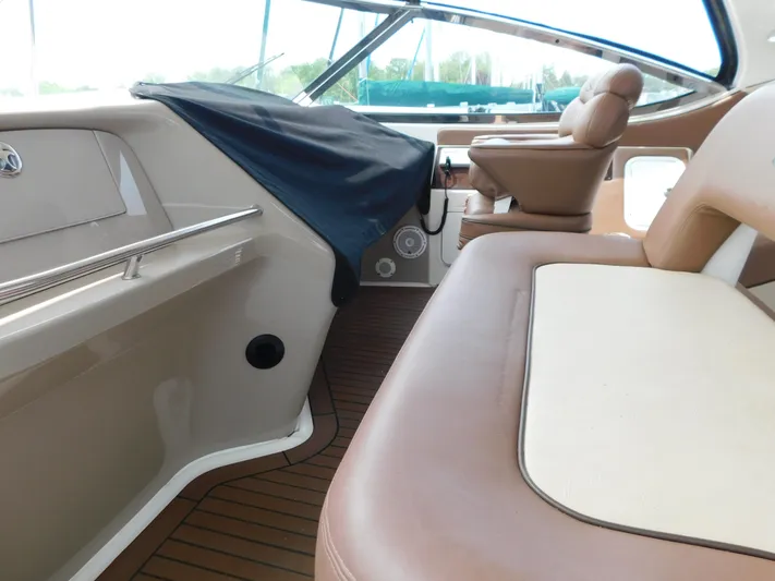  Yacht Photos Pics Interior view of 2001 Sea Ray 510 Sundancer yacht with tan seating and wood flooring.