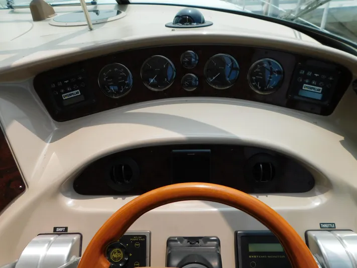  Yacht Photos Pics 2001 Sea Ray 510 Sundancer helm with gauges and wooden steering wheel.