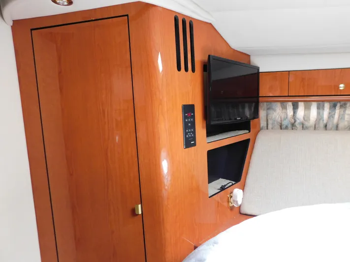  Yacht Photos Pics Interior of 2001 Sea Ray 510 Sundancer with wood paneling and mounted TV.