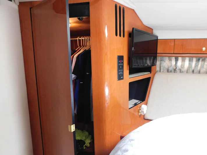  Yacht Photos Pics Interior of 2001 Sea Ray 510 Sundancer with closet, TV, and bed.