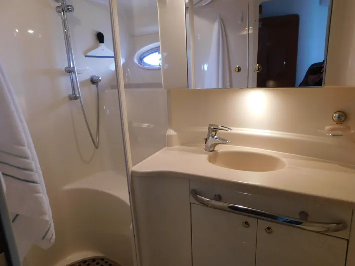  Yacht Photos Pics Bathroom interior of 2001 Sea Ray 510 Sundancer yacht, featuring shower and sink.