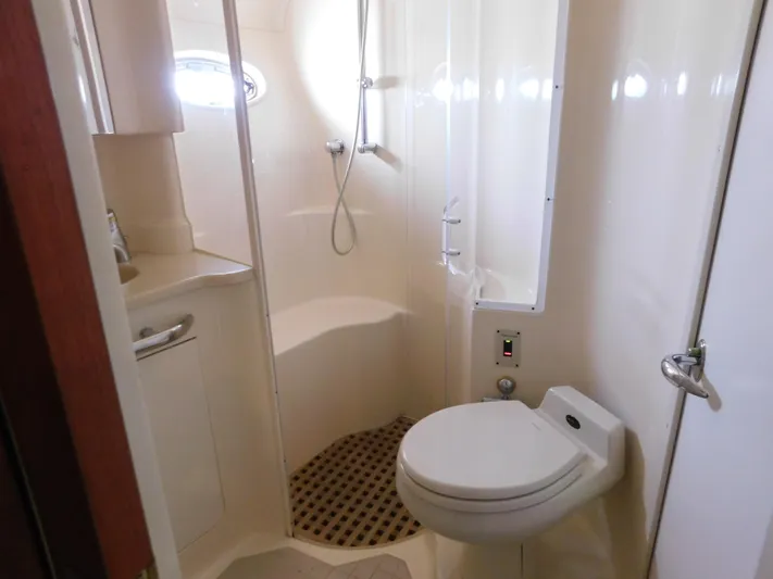  Yacht Photos Pics Bathroom interior of 2001 Sea Ray 510 Sundancer yacht, featuring shower and toilet.
