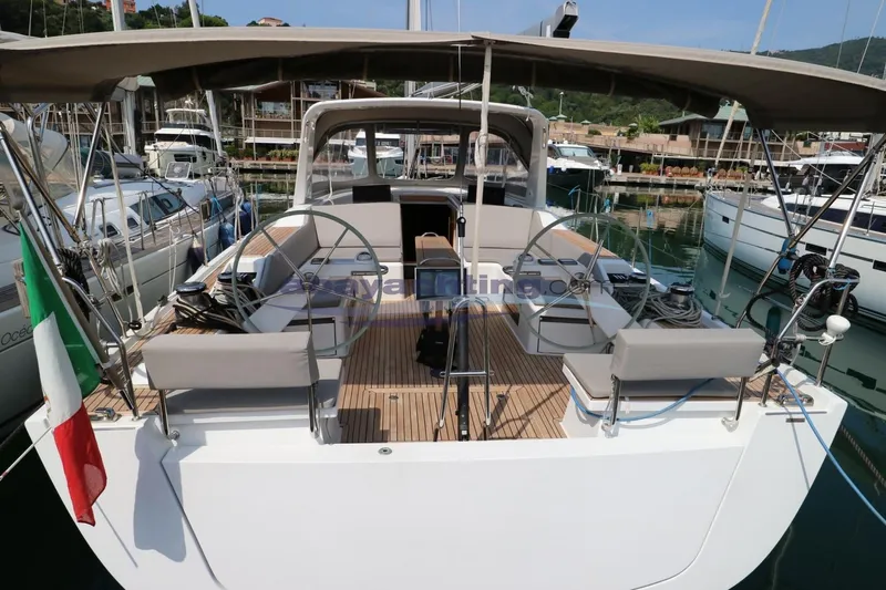  Yacht Photos Pics Grand Soleil 46 LC 2016 yacht with dual steering wheels, docked in a marina.