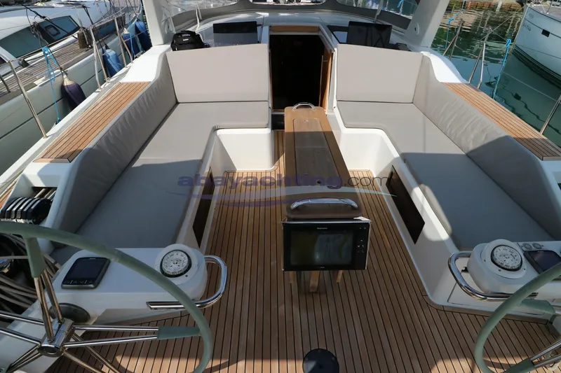  Yacht Photos Pics Spacious cockpit of 2016 Grand Soleil 46 LC yacht with teak decking and cushioned seating.