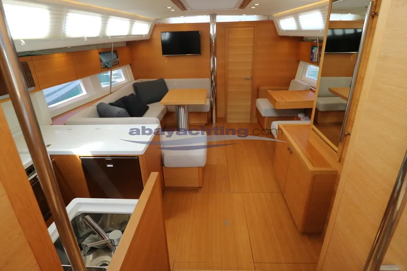  Yacht Photos Pics Luxurious interior of 2016 Grand Soleil 46 LC yacht with modern wood finish.