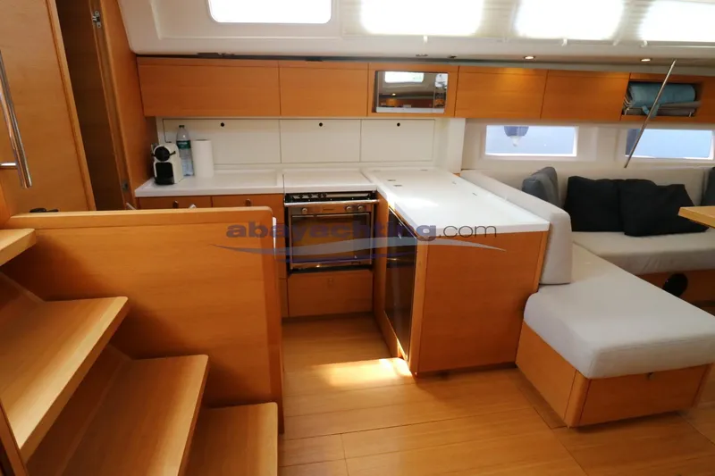  Yacht Photos Pics Interior of 2016 Grand Soleil 46 LC yacht, featuring modern kitchen and seating area.