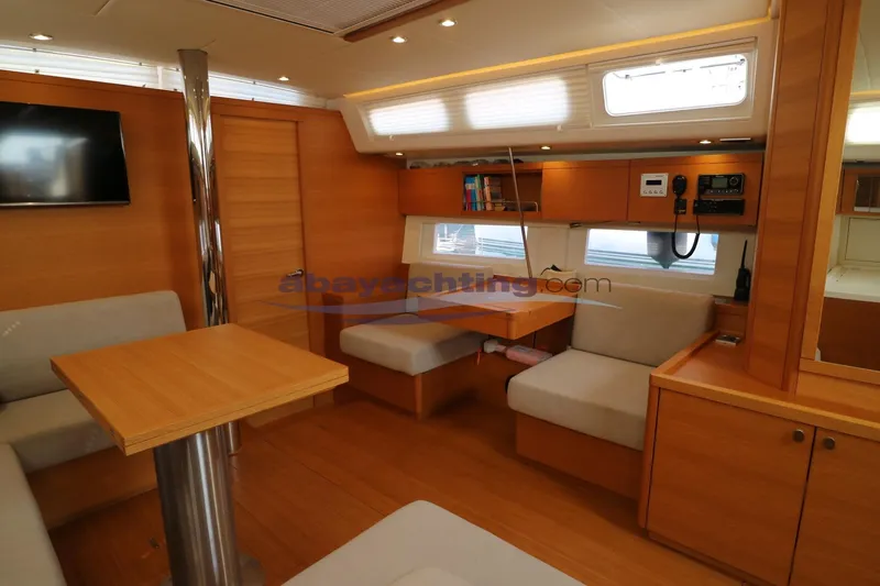  Yacht Photos Pics Luxurious interior of 2016 Grand Soleil 46 LC yacht with modern wood finish.