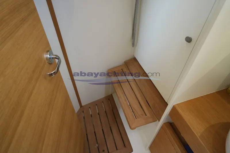  Yacht Photos Pics Interior of 2016 Grand Soleil 46 LC yacht, featuring wooden steps and modern design.